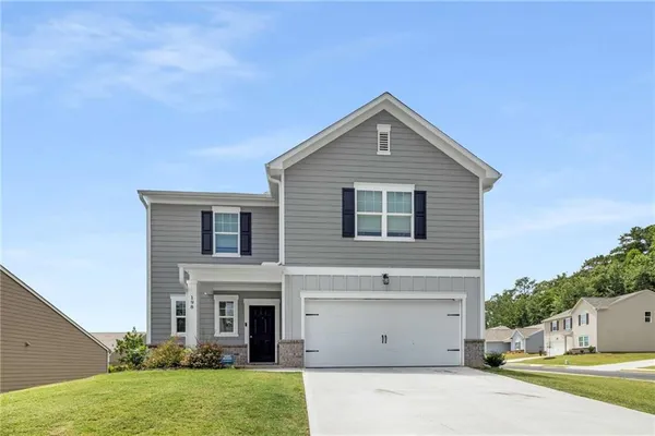 a front view of house with yard