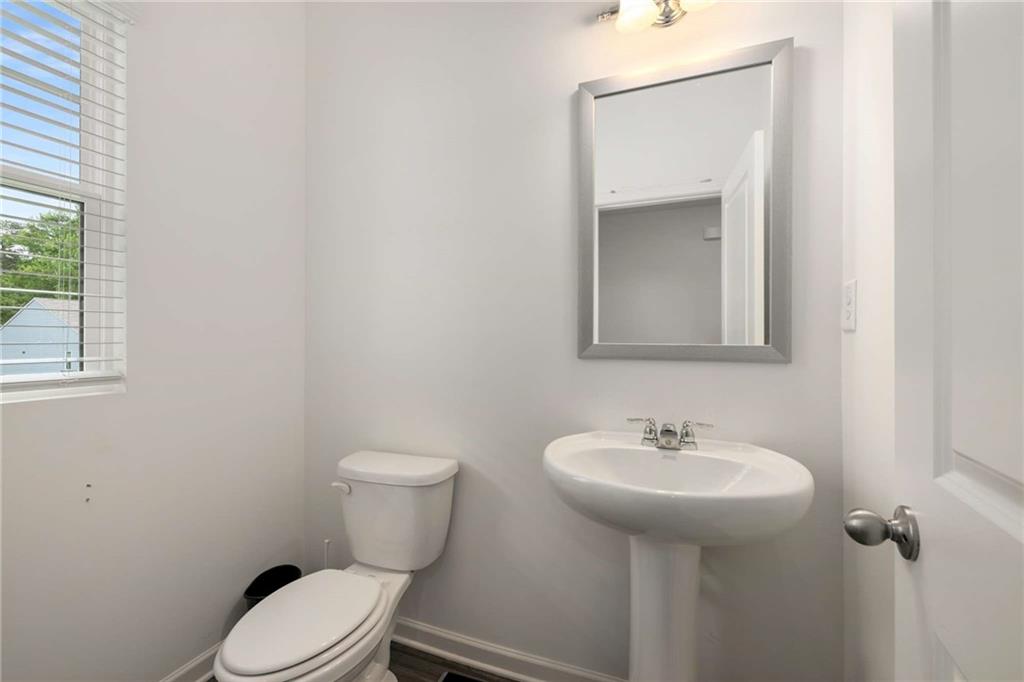 198 Colbury Street Villa Rica, GA 30180 - Photo 12 of 28 a bathroom with a toilet sink and mirror