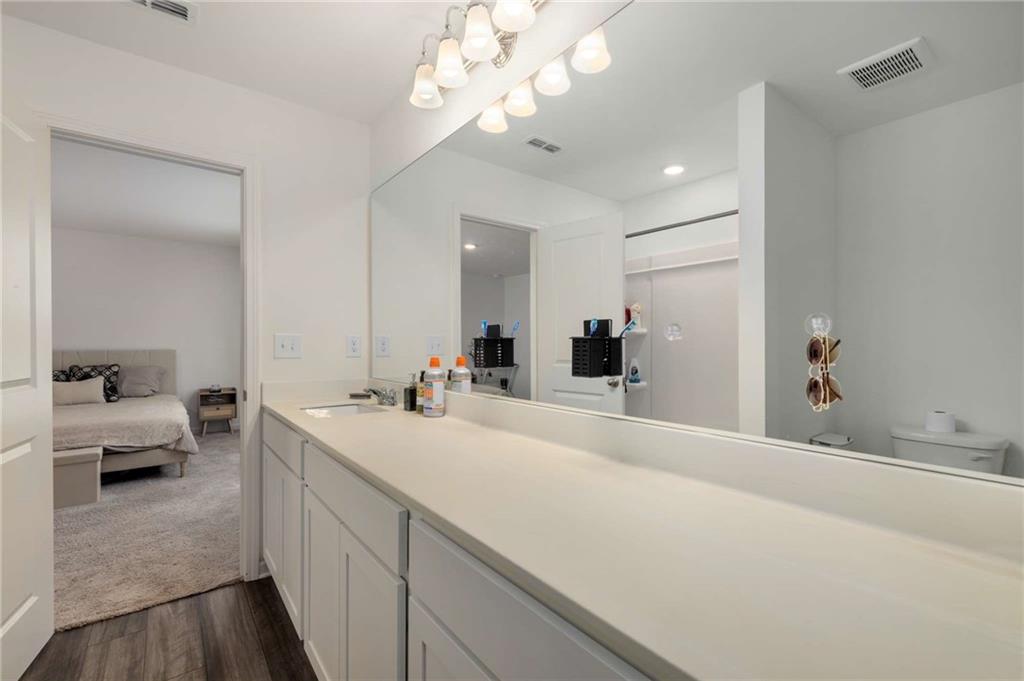 198 Colbury Street Villa Rica, GA 30180 - Photo 14 of 28 a spacious bathroom with a double vanity sink and a mirror