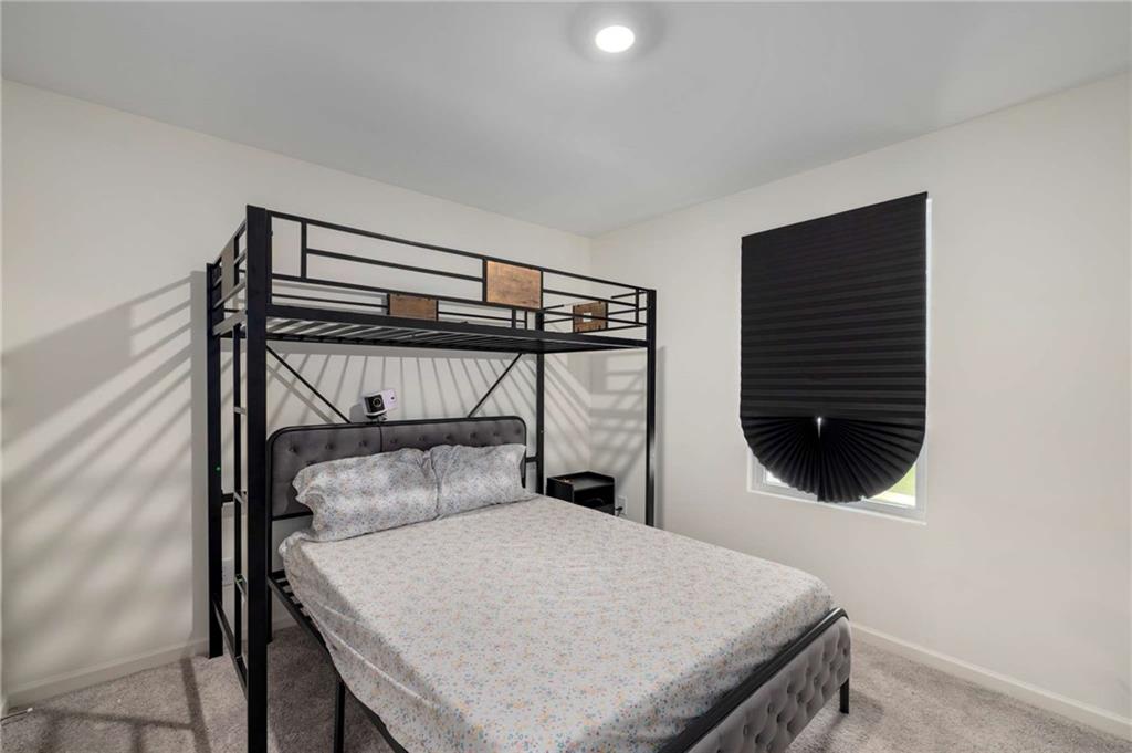 198 Colbury Street Villa Rica, GA 30180 - Photo 20 of 28 a bedroom with a bed and a window