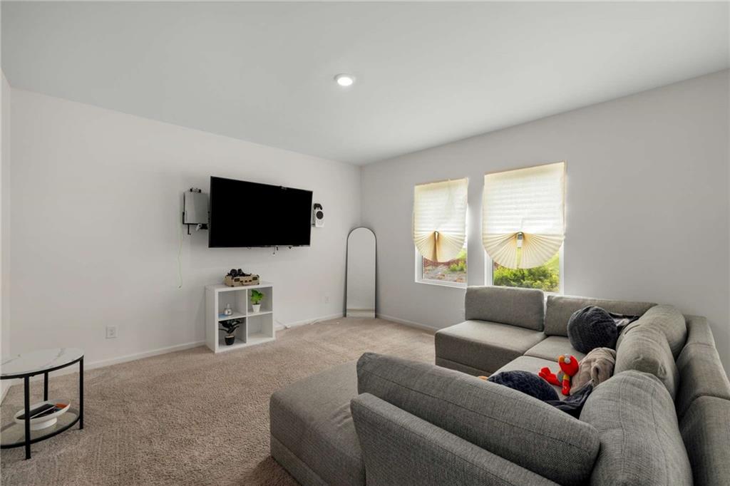 198 Colbury Street Villa Rica, GA 30180 - Photo 3 of 28 a living room with furniture and a flat screen tv