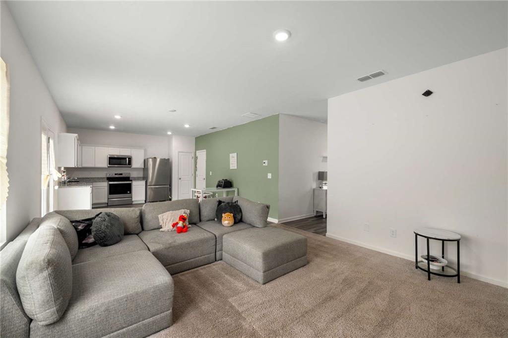198 Colbury Street Villa Rica, GA 30180 - Photo 5 of 28 a living room with furniture and kitchen view
