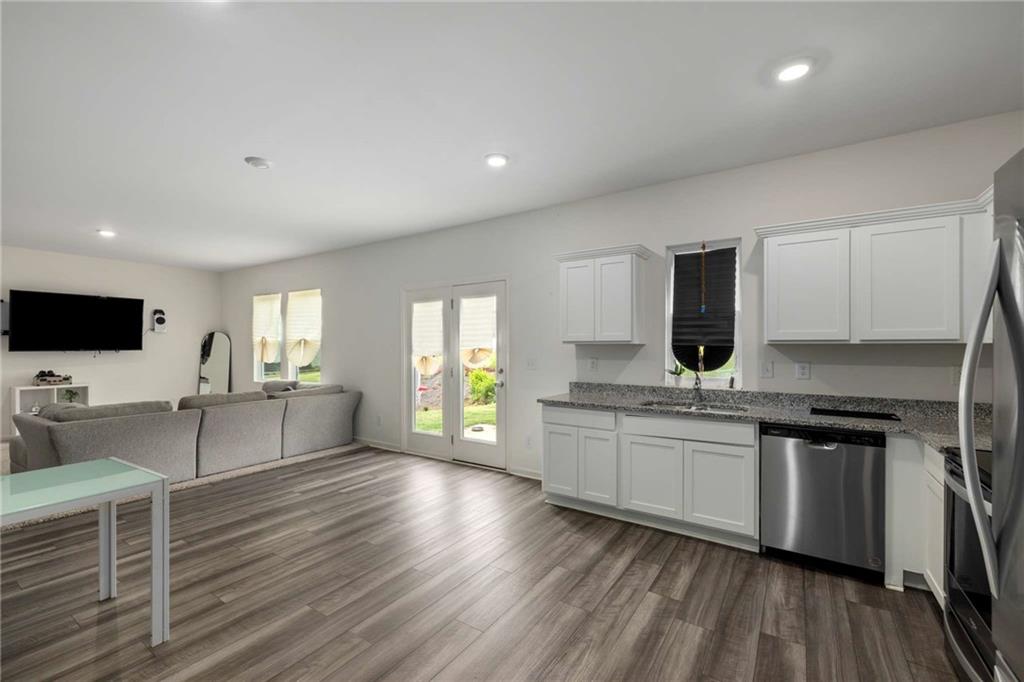 198 Colbury Street Villa Rica, GA 30180 - Photo 10 of 28 a large kitchen with a large counter top appliances and cabinets
