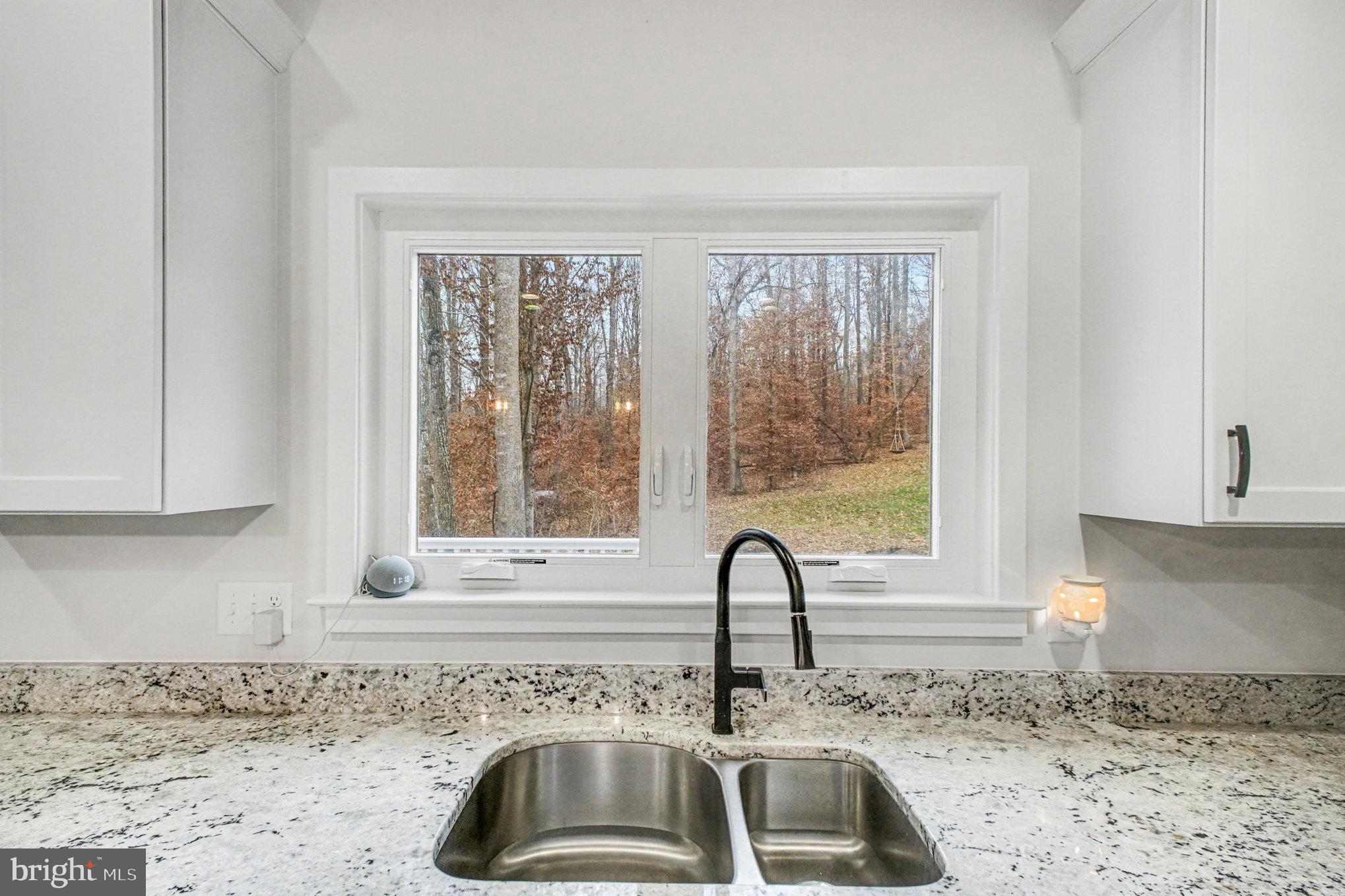 580 Kellogg Mill Road Fredericksburg, VA 22406 - Photo 13 of 41 a kitchen with granite countertop a sink and a window