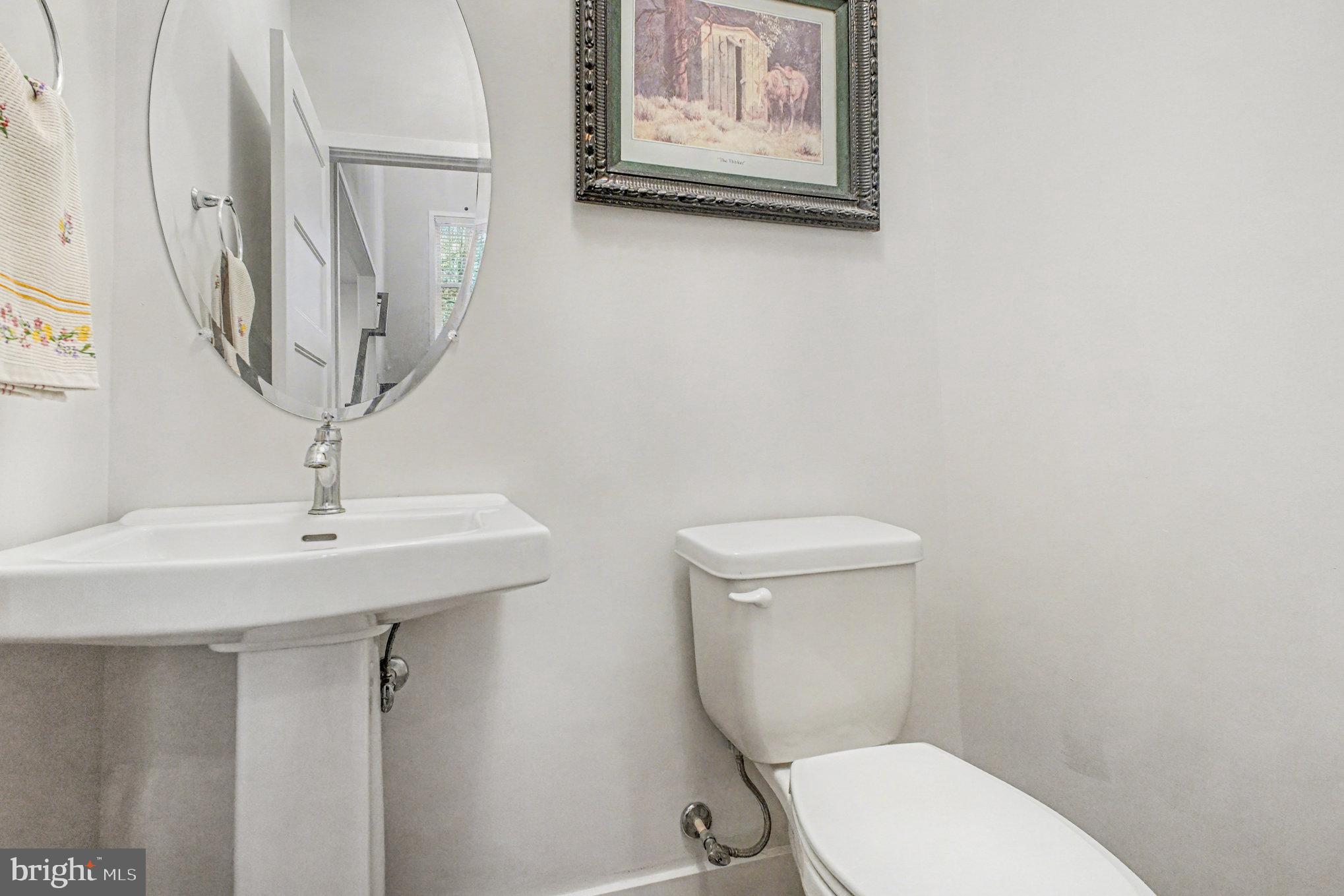 580 Kellogg Mill Road Fredericksburg, VA 22406 - Photo 14 of 41 a bathroom with a toilet a sink and a mirror