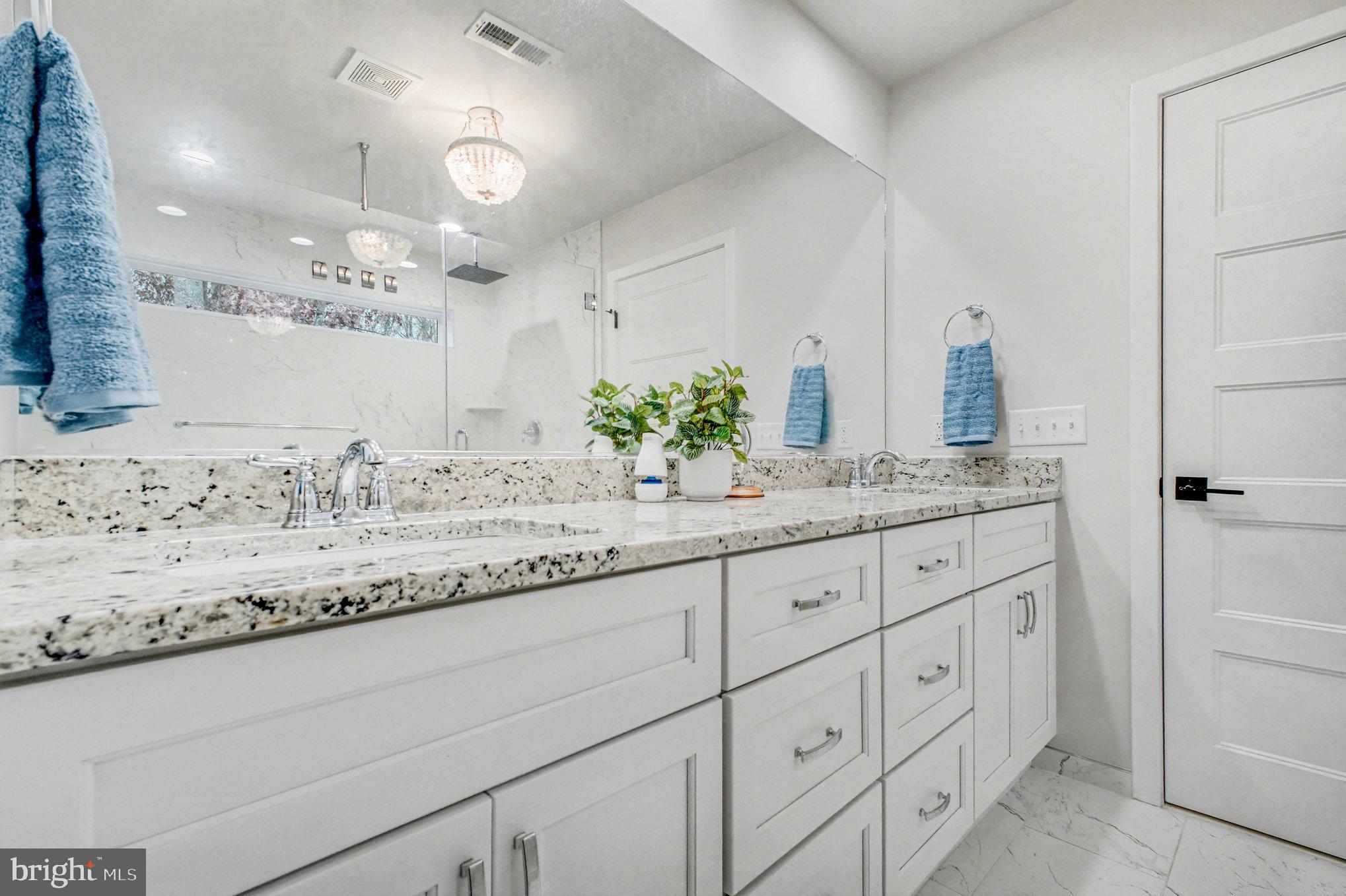 580 Kellogg Mill Road Fredericksburg, VA 22406 - Photo 17 of 41 a bathroom with a granite countertop sink and a mirror