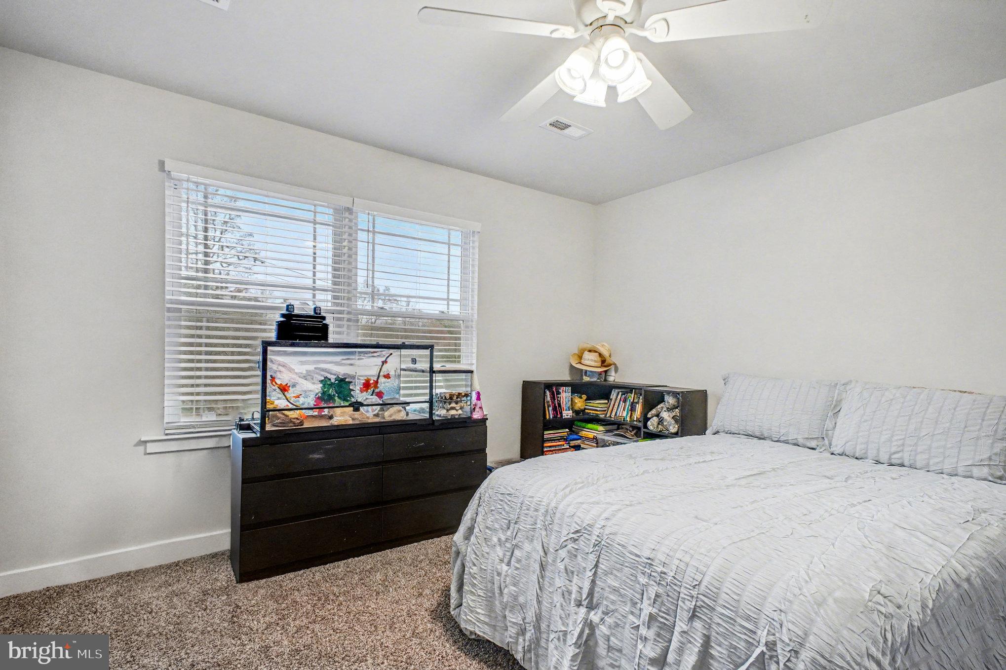 580 Kellogg Mill Road Fredericksburg, VA 22406 - Photo 21 of 41 a bedroom with a bed and a window