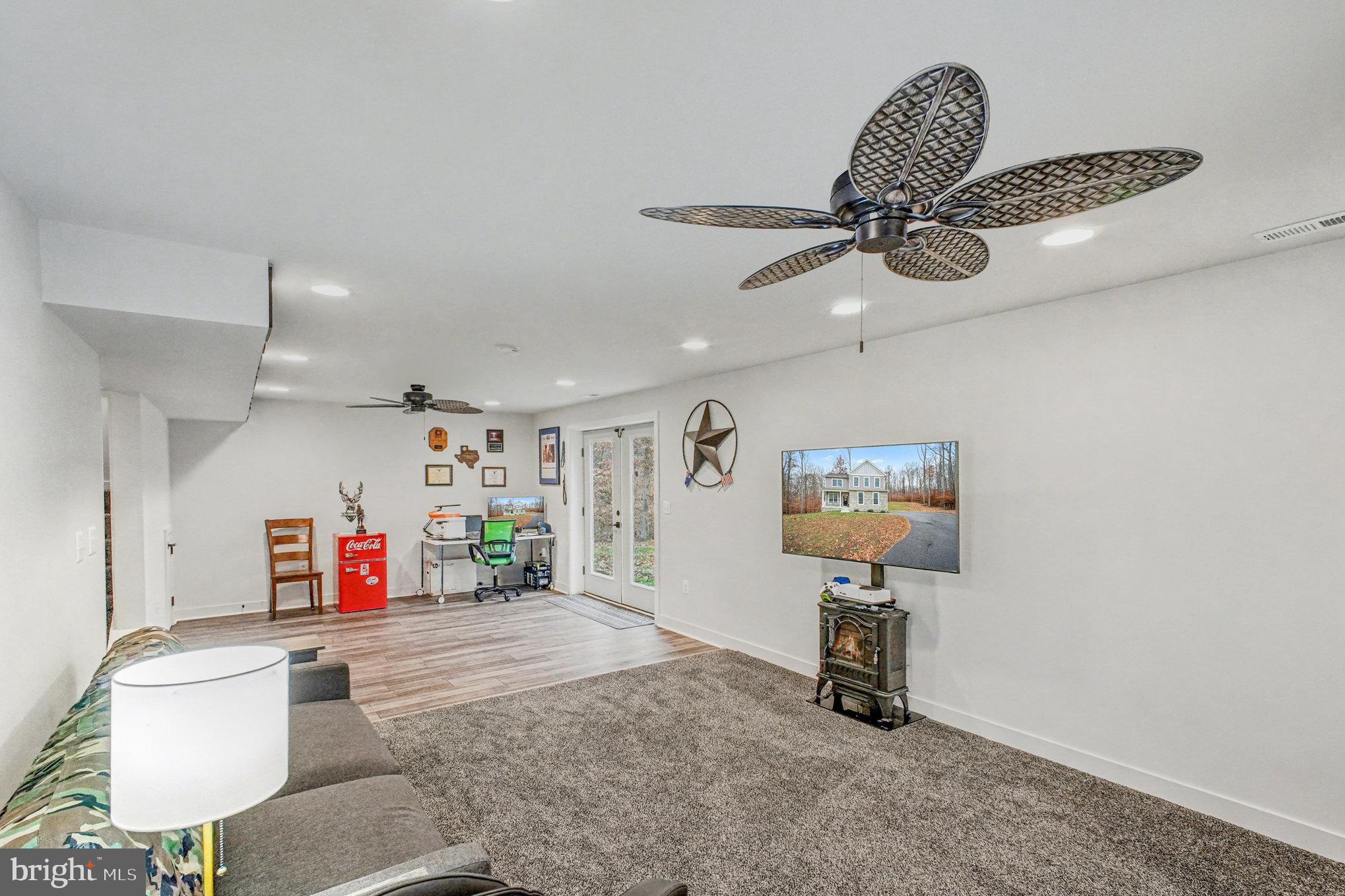 580 Kellogg Mill Road Fredericksburg, VA 22406 - Photo 26 of 41 a living room with furniture and a flat screen tv