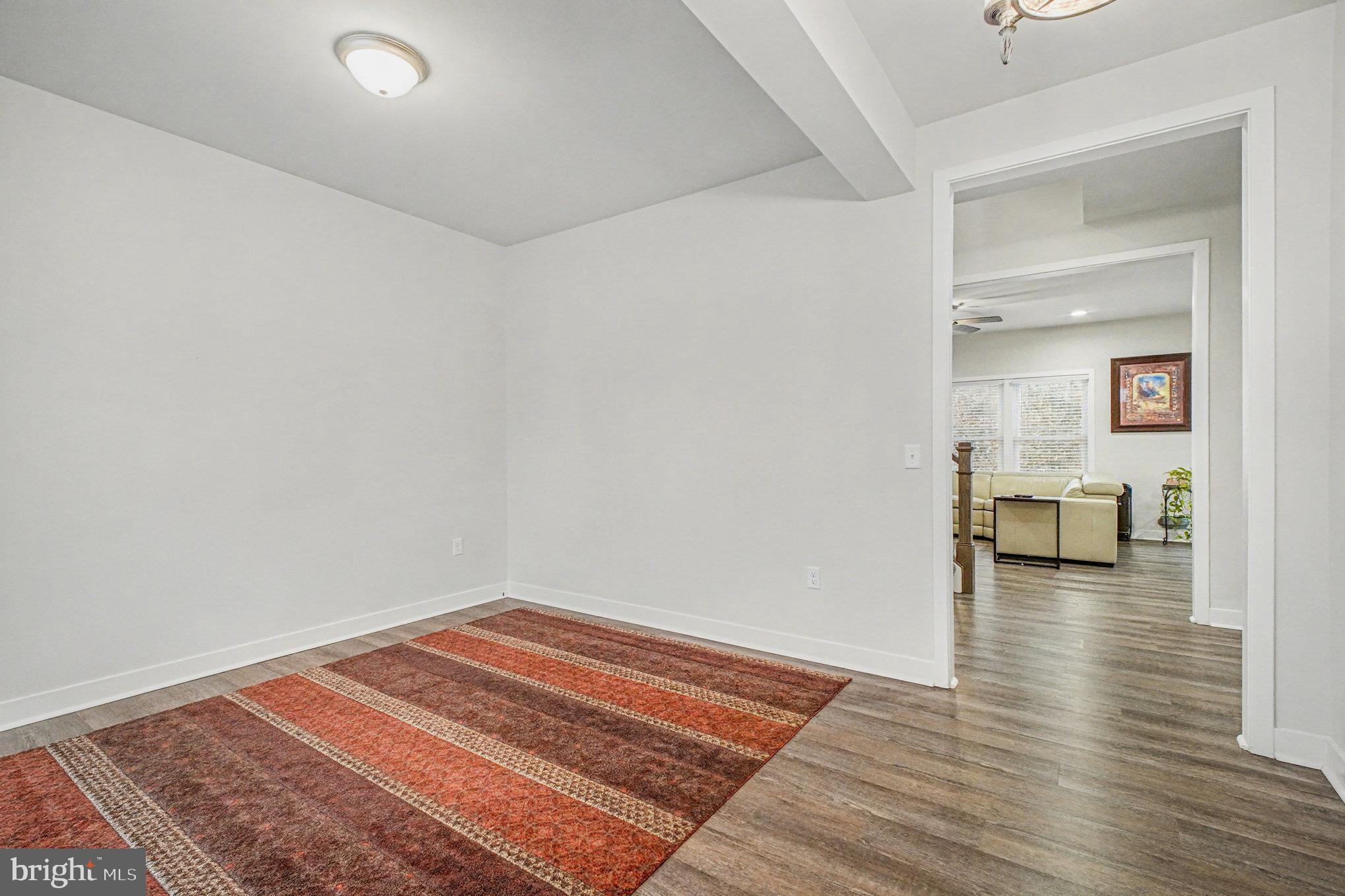 580 Kellogg Mill Road Fredericksburg, VA 22406 - Photo 5 of 41 a view of a room with wooden floor and furniture