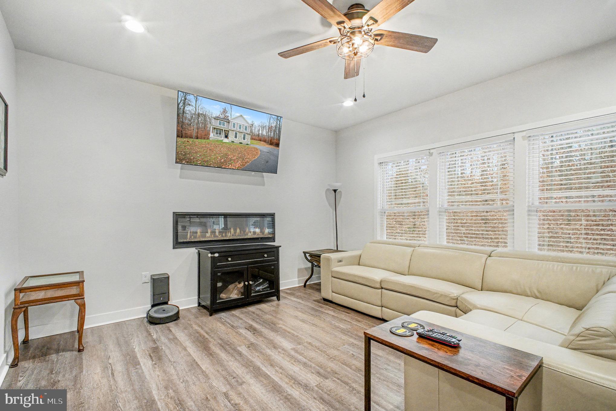 580 Kellogg Mill Road Fredericksburg, VA 22406 - Photo 7 of 41 a living room with furniture and a fireplace