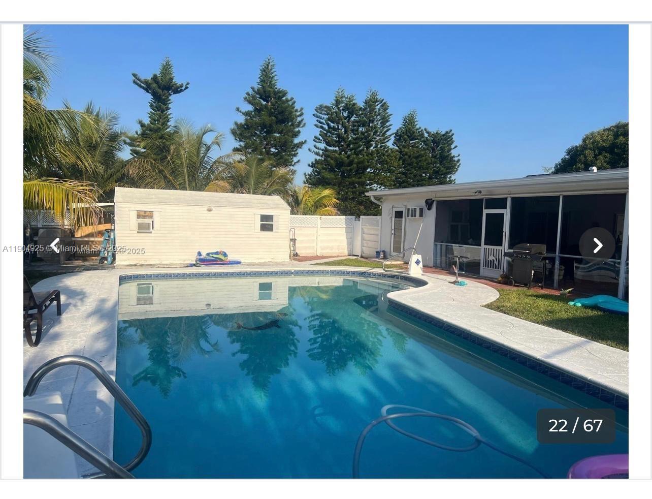 5001 Madison Street Hollywood, FL 33021 - Photo 11 of 23 a view of swimming pool with outdoor seating and yard in the back