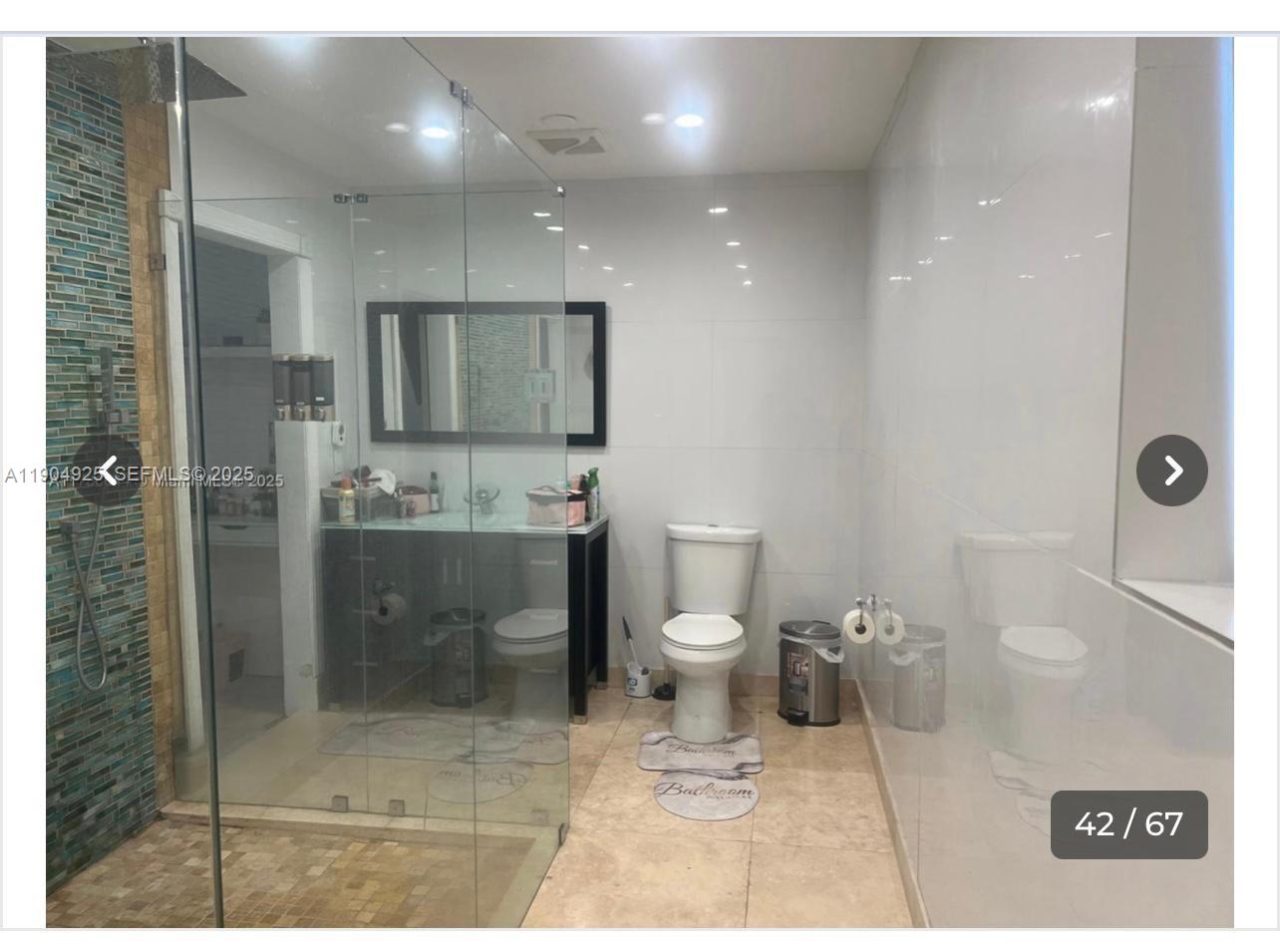 5001 Madison Street Hollywood, FL 33021 - Photo 14 of 23 a bathroom with a toilet sink and shower