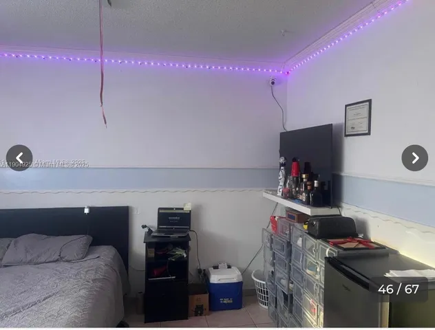 a room with furniture and a flat screen tv