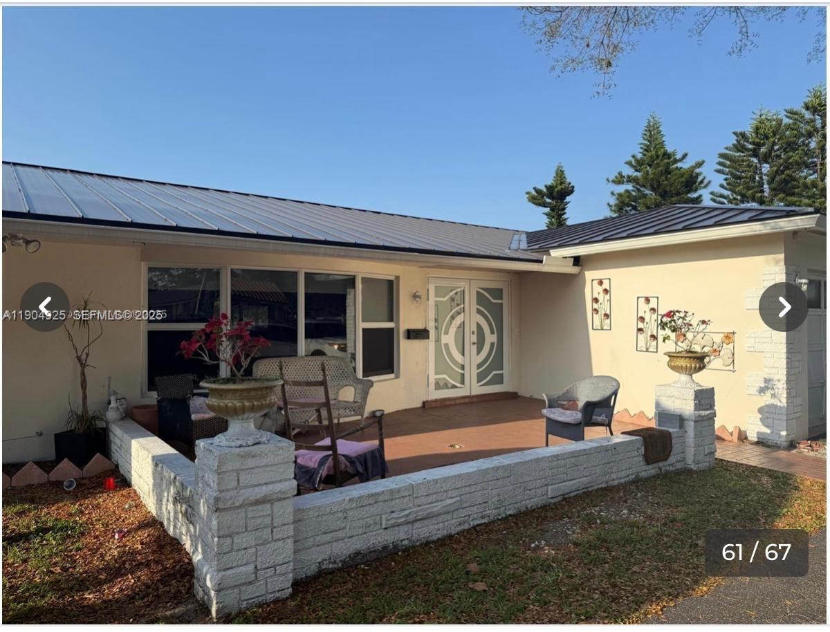 5001 Madison Street Hollywood, FL 33021 - Photo 18 of 23 a living room with furniture and a potted plant