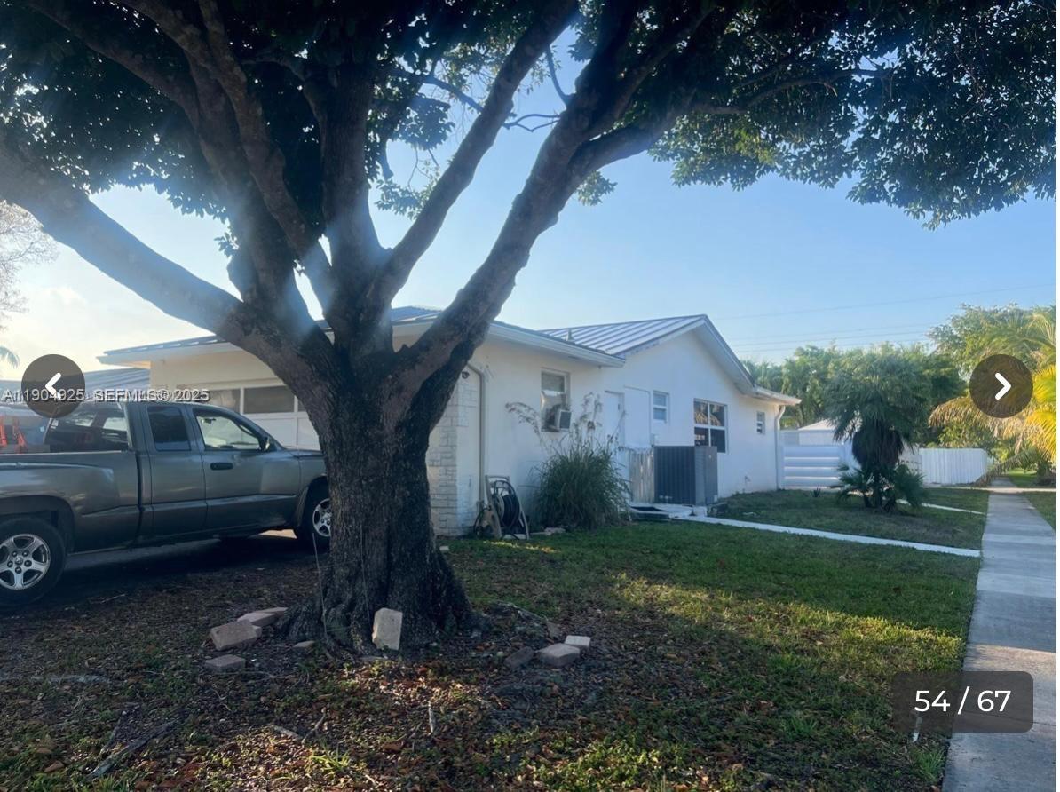 5001 Madison Street Hollywood, FL 33021 - Photo 19 of 23 a view of a yard in front of a house
