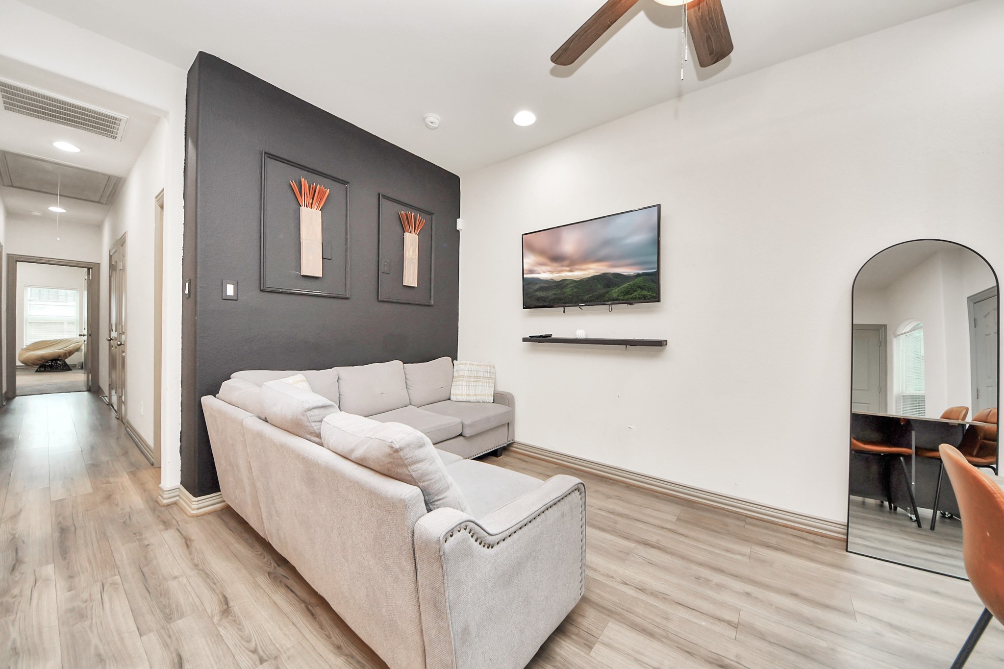 5334 Pershing Street Houston, TX 77033 - Photo 25 of 43 a living room with furniture and a wooden floor