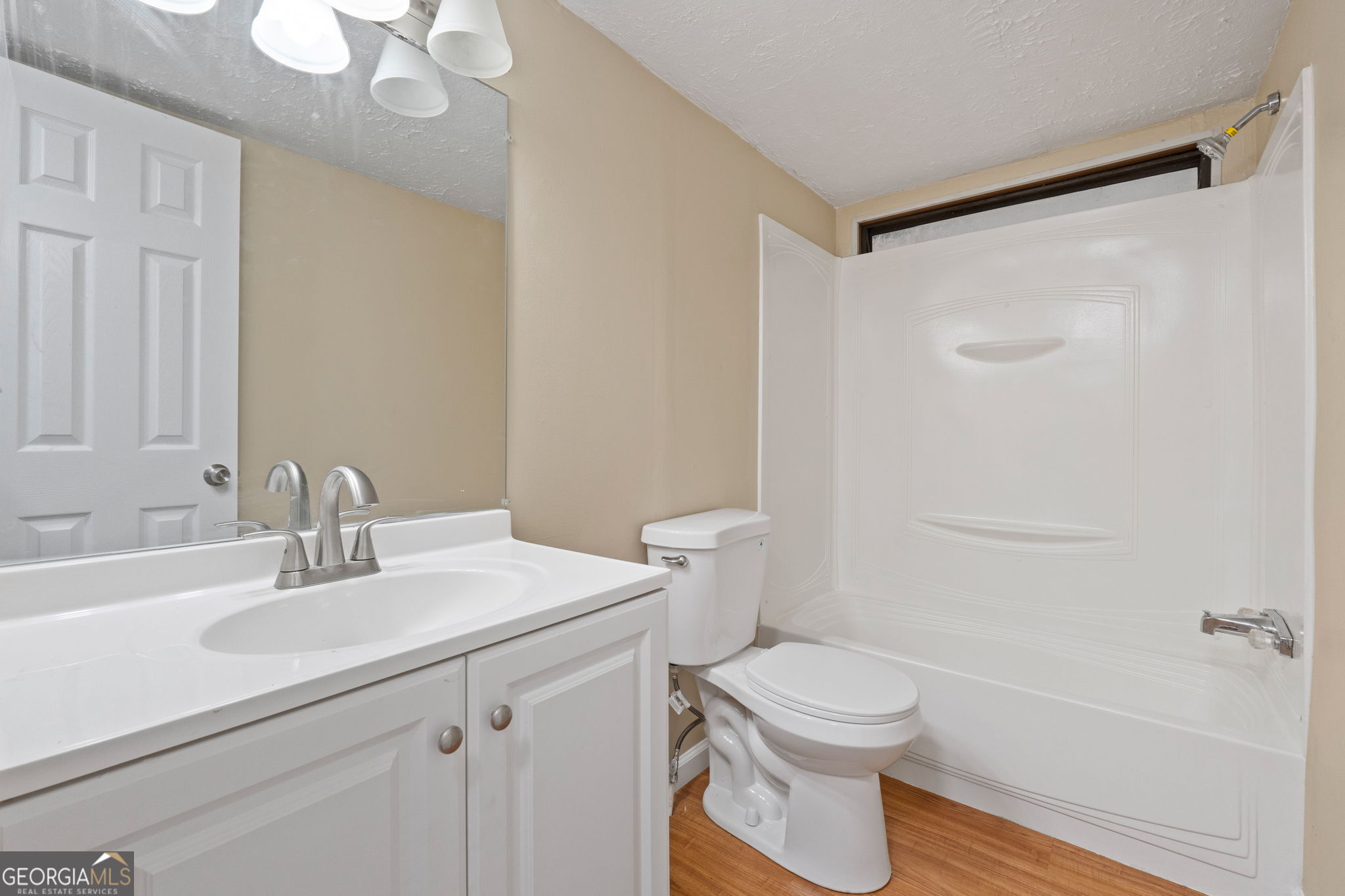 361 Hemlock Lane Locust Grove, GA 30248 - Photo 14 of 20 a bathroom with a sink a toilet and shower