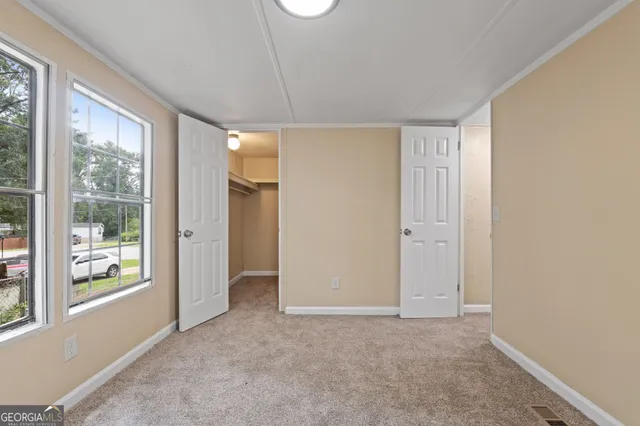 a view of an empty room with a window