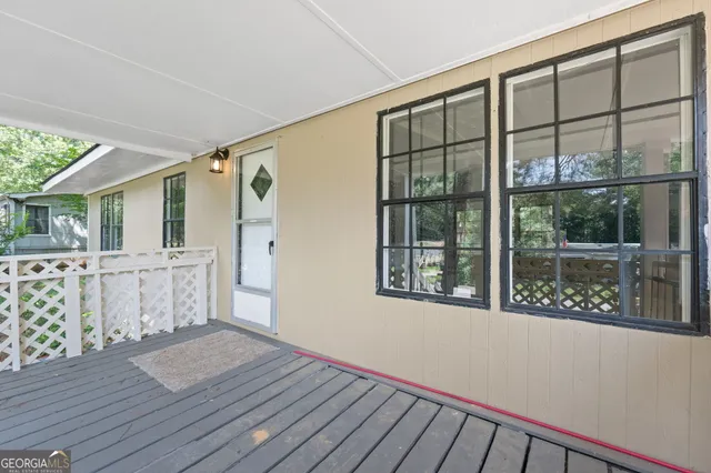 a view of a house with wooden floor and iron stairs