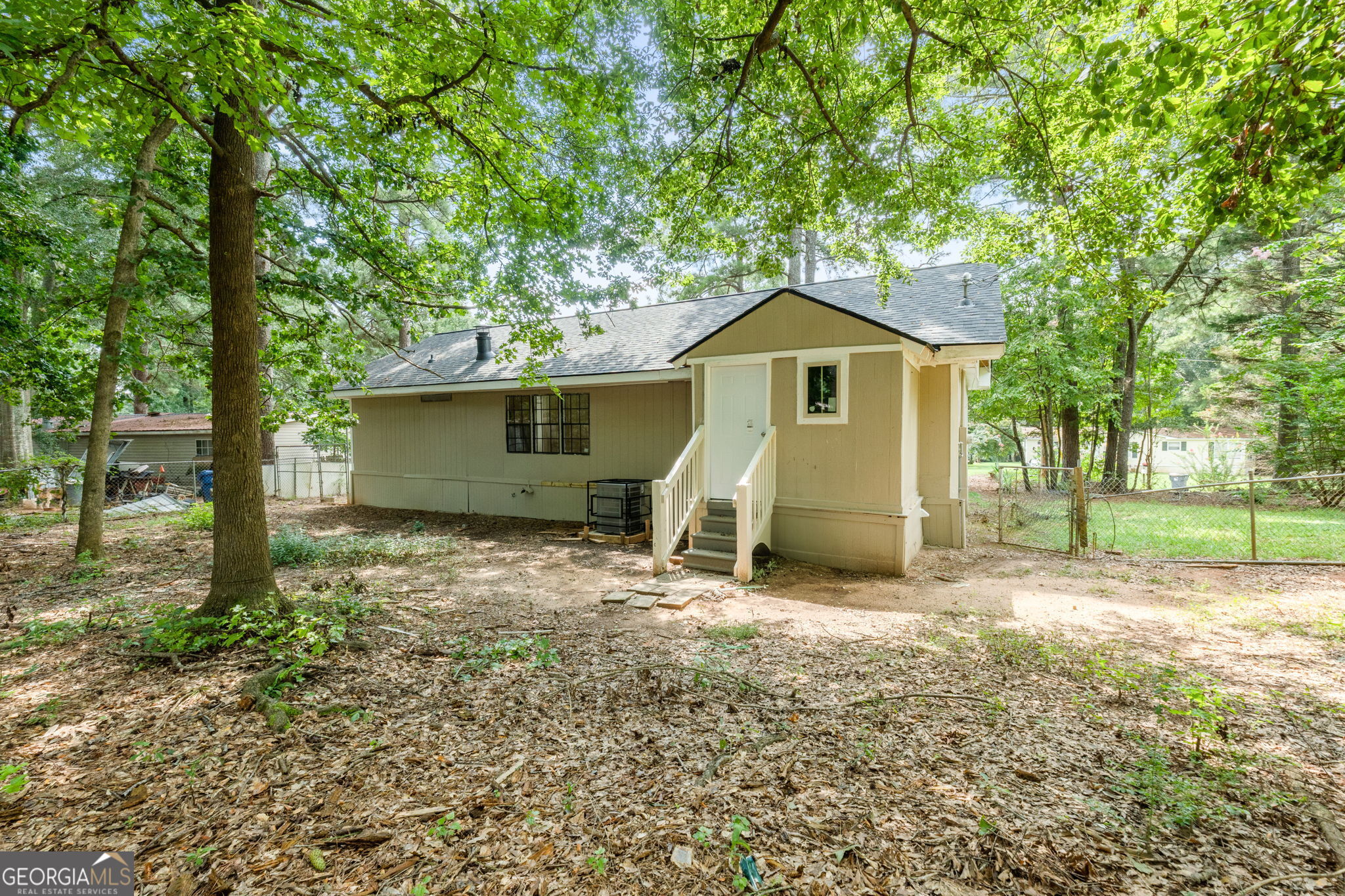 361 Hemlock Lane Locust Grove, GA 30248 - Photo 20 of 20 a view of a house with a yard and large tree