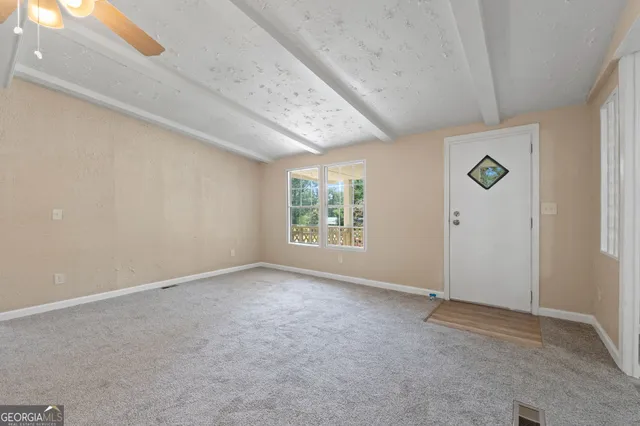 an empty room with windows