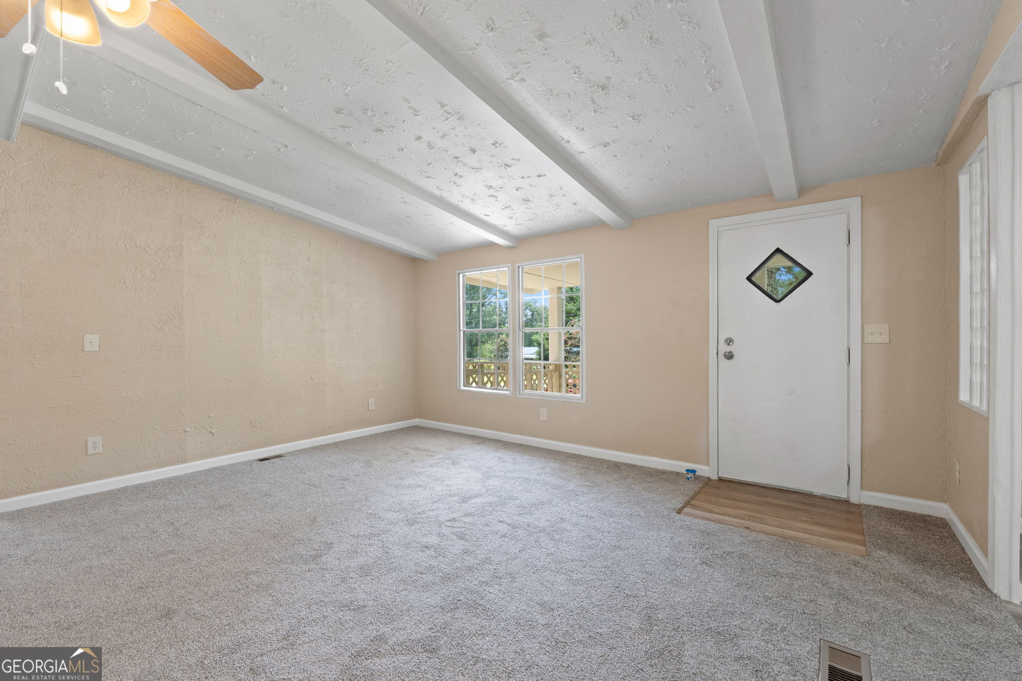 361 Hemlock Lane Locust Grove, GA 30248 - Photo 8 of 20 an empty room with windows