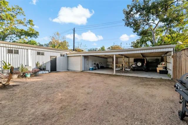 a view of a house with a porch and furniture