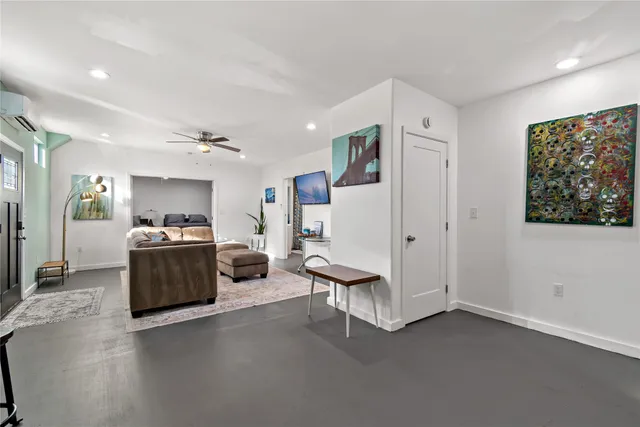 a living room with furniture and a window