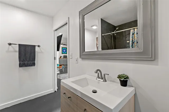 a bathroom with a sink and a mirror