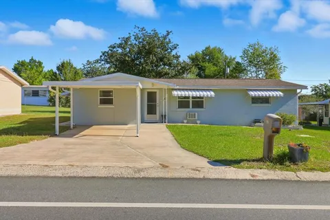 a view of a backyard of the house
