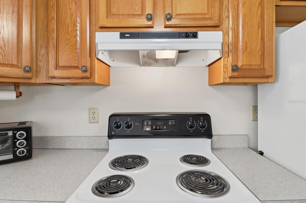 11 Roosevelt Boulevard Beverly Hills, FL 34465 - Photo 11 of 35 a close view of kitchen stove a sink and dishwasher with cabinets