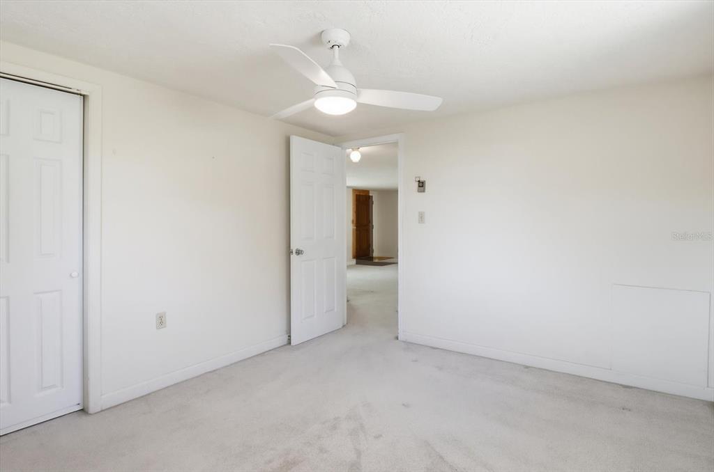 11 Roosevelt Boulevard Beverly Hills, FL 34465 - Photo 17 of 35 an empty room with a ceiling fan and bathroom