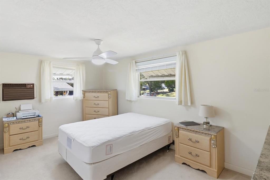 11 Roosevelt Boulevard Beverly Hills, FL 34465 - Photo 20 of 35 a bedroom with a bed and a tv on the dresser