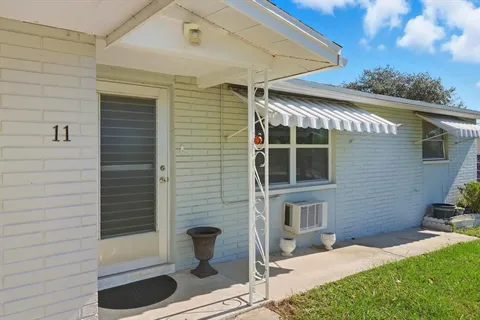 a view of house with backyard space and porch