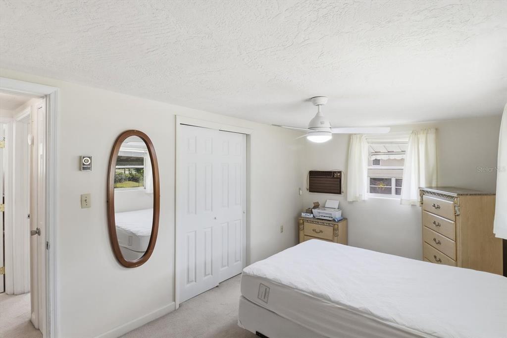 11 Roosevelt Boulevard Beverly Hills, FL 34465 - Photo 21 of 35 a bedroom with a bed and a mirror