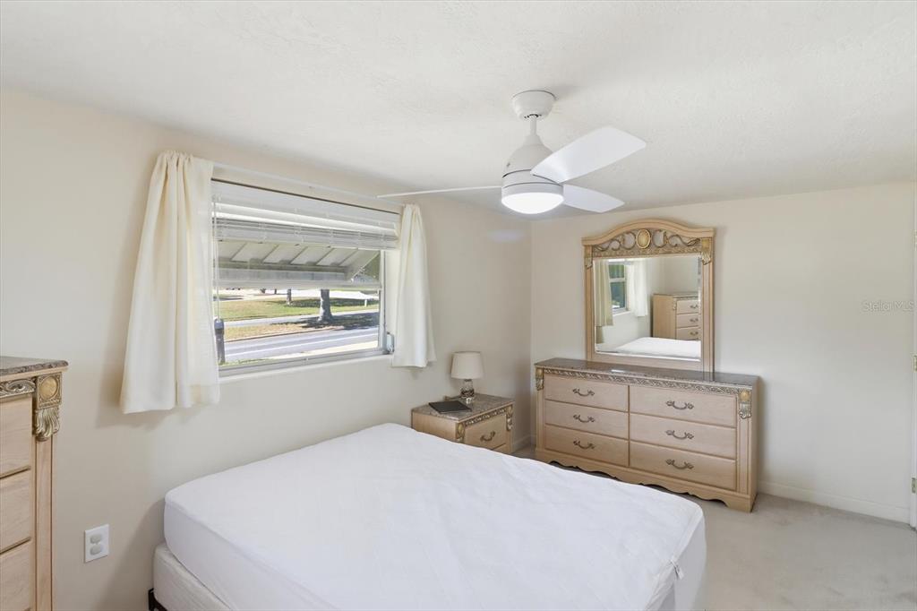 11 Roosevelt Boulevard Beverly Hills, FL 34465 - Photo 22 of 35 a bedroom with a bed and a dresser