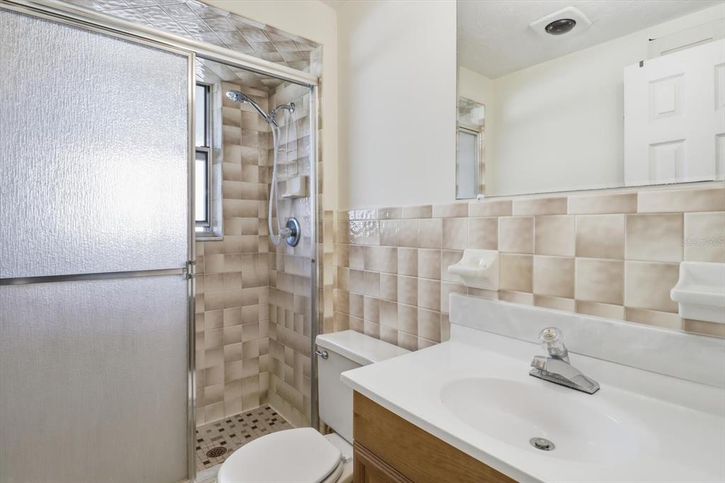 11 Roosevelt Boulevard Beverly Hills, FL 34465 - Photo 27 of 35 a bathroom with a sink toilet and shower