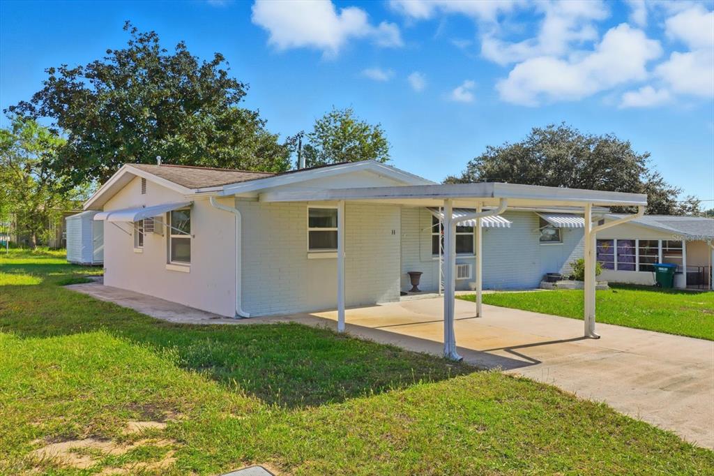 11 Roosevelt Boulevard Beverly Hills, FL 34465 - Photo 32 of 35 a view of a house with yard and tree s