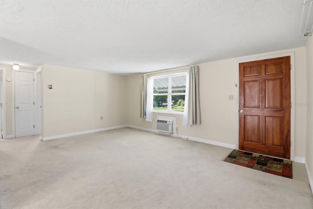 11 Roosevelt Boulevard Beverly Hills, FL 34465 - Photo 7 of 35 an empty room with windows