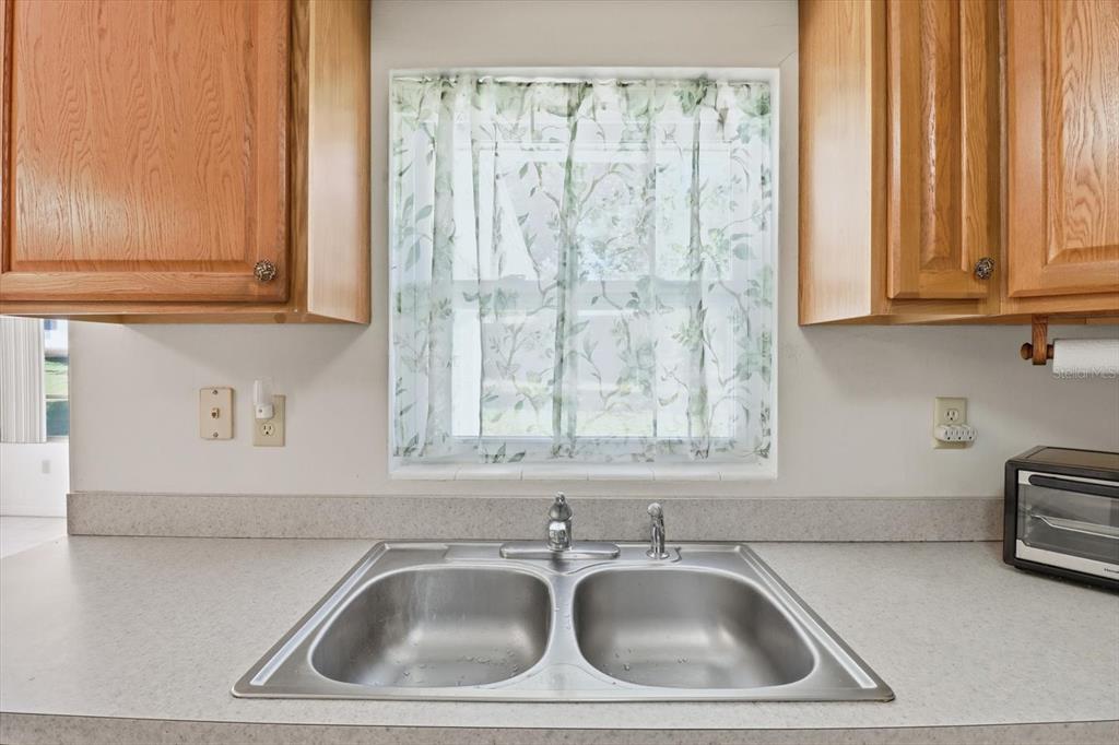 11 Roosevelt Boulevard Beverly Hills, FL 34465 - Photo 10 of 35 a sink and a window