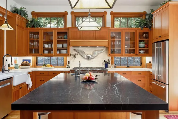 a view of a hallway with wooden floor and entryway