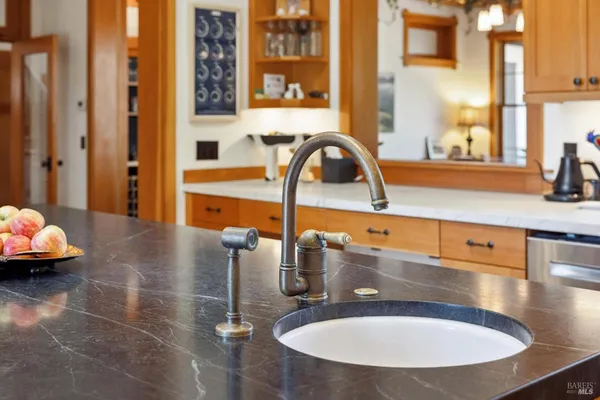 a bathroom with double vanity sinks and a mirror