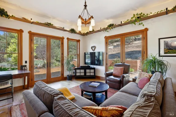 a room with furniture and a flat screen tv