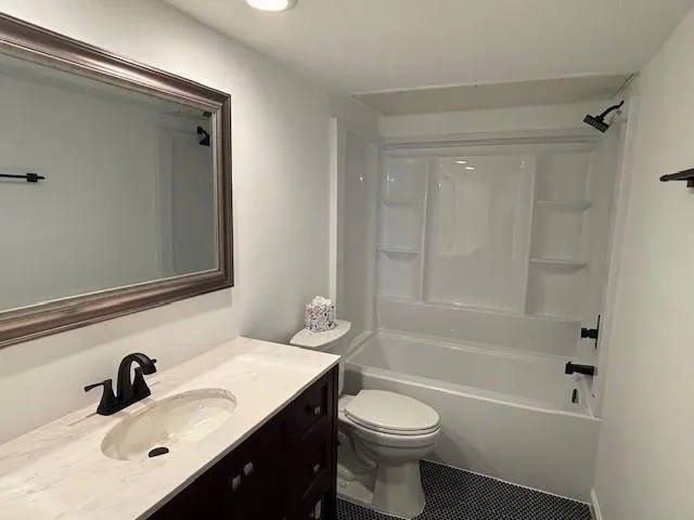 a bathroom with a sink a toilet and a bathtub