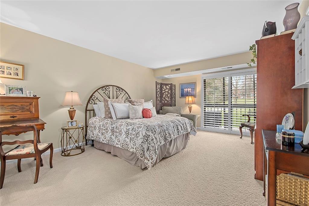 1500 Cochran Road, Unit 510 Pittsburgh, PA 15243 - Photo 17 of 25 a bedroom with two beds and large window