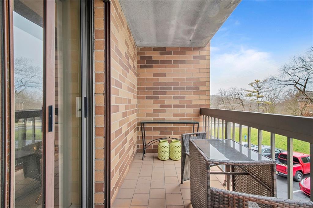1500 Cochran Road, Unit 510 Pittsburgh, PA 15243 - Photo 21 of 25 a view of balcony with a potted plant
