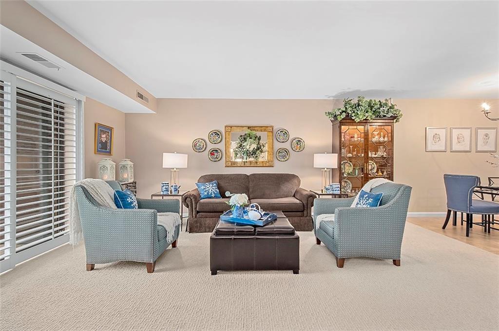 1500 Cochran Road, Unit 510 Pittsburgh, PA 15243 - Photo 8 of 25 a living room with furniture and a large window