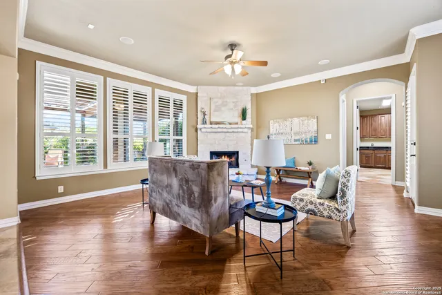 a kitchen with kitchen island granite countertop a stove sink and refrigerator