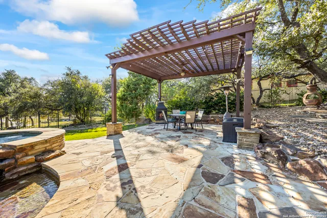 an aerial view of a house with garden space and street view