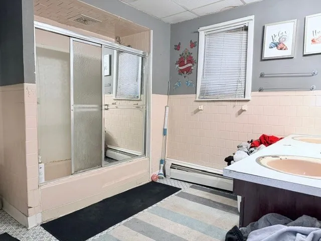 a bathroom with a bathtub and a sink